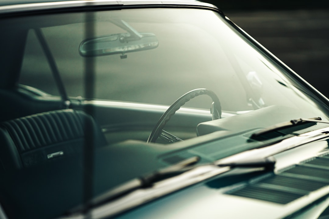 a-close-up-of-a-car-with-a-steering-wheel-hbci2wle01w